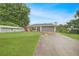 Charming home featuring a well-manicured lawn and inviting curb appeal at 22353 Blanchard Ave, Port Charlotte, FL 33952