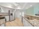 Modern kitchen featuring stainless steel appliances, granite countertops, and white cabinetry at 22353 Blanchard Ave, Port Charlotte, FL 33952