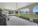 The screened-in lanai overlooks the expansive backyard of this property at 22353 Blanchard Ave, Port Charlotte, FL 33952