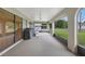 Covered lanai with a grill, overhead lighting and view of the large backyard at 22353 Blanchard Ave, Port Charlotte, FL 33952