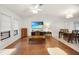 Open-concept living area featuring hardwood floors, a ceiling fan, and a dining space at 22353 Blanchard Ave, Port Charlotte, FL 33952
