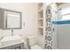 Bright bathroom with stand up shower and ample storage at 233 N New York Ave, Englewood, FL 34223