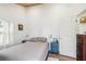 Cozy bedroom with matching bedside tables, and a bed with stylish pillows at 233 N New York Ave, Englewood, FL 34223