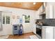 Bright kitchen features stainless appliances, subway tile backsplash, and wooden ceiling detail at 233 N New York Ave, Englewood, FL 34223