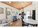 Bright and modern kitchen featuring white cabinets, stainless steel appliances, and wood floors at 233 N New York Ave, Englewood, FL 34223