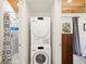The conveniently located laundry area features a stacked washer and dryer at 233 N New York Ave, Englewood, FL 34223