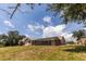 Expansive backyard featuring a screened enclosure, perfect for outdoor relaxation and entertainment at 238 Mark Twain Ln, Rotonda West, FL 33947