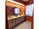 Bathroom featuring double vanity and a large mirror at 238 Mark Twain Ln, Rotonda West, FL 33947