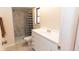 Bathroom features a shower, tiled floor, vanity with sink, and a window at 238 Mark Twain Ln, Rotonda West, FL 33947