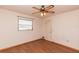 Bedroom featuring wood-look floors, a ceiling fan, and a window view of outdoors at 238 Mark Twain Ln, Rotonda West, FL 33947