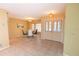 Bright dining room with table set, tile flooring, and double door entrance at 238 Mark Twain Ln, Rotonda West, FL 33947