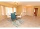 Bright dining room with glass table, seating, and tile floors at 238 Mark Twain Ln, Rotonda West, FL 33947