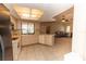 Open concept kitchen with tile floors, and a seamless view to the living room at 238 Mark Twain Ln, Rotonda West, FL 33947