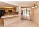 Spacious eat-in kitchen featuring tile flooring, and access to the pool area at 238 Mark Twain Ln, Rotonda West, FL 33947