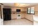 Functional kitchen with white appliances and tile flooring at 238 Mark Twain Ln, Rotonda West, FL 33947