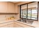 Kitchen sink overlooking the screened pool area at 238 Mark Twain Ln, Rotonda West, FL 33947