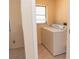 Laundry room with side-by-side washer and dryer and a window at 238 Mark Twain Ln, Rotonda West, FL 33947
