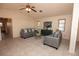 Comfortable living room featuring tile flooring, ceiling fan and natural light at 238 Mark Twain Ln, Rotonda West, FL 33947