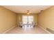 Cozy living room featuring tile flooring, chairs, and sliding glass doors at 238 Mark Twain Ln, Rotonda West, FL 33947