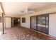 Covered patio with patterned tile flooring and sliding glass doors to the interior at 238 Mark Twain Ln, Rotonda West, FL 33947