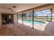 Outdoor pool under a screened enclosure with access from the patio at 238 Mark Twain Ln, Rotonda West, FL 33947