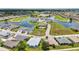 A landscape aerial view of beautiful homes, a lake, and a golf course in a residential community at 24312 Westgate Blvd, Port Charlotte, FL 33980