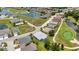 An aerial view showing neighborhood homes, water features, and landscaping on a golf course community at 24312 Westgate Blvd, Port Charlotte, FL 33980