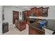 Kitchen with granite countertops, stainless steel appliances, and central island with a sink at 24312 Westgate Blvd, Port Charlotte, FL 33980