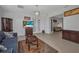 Inviting living room with stylish decor, tile flooring, and comfortable seating at 24312 Westgate Blvd, Port Charlotte, FL 33980
