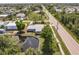 Aerial view of a single-Gathering home, featuring a waterfront canal and lush landscaping at 3129 Buttonwood Pl, Punta Gorda, FL 33950