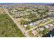 Wide aerial shot shows house, canal access, and the surrounding neighborhood at 3129 Buttonwood Pl, Punta Gorda, FL 33950