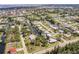 Wide aerial view of a neighborhood with houses on canals and a waterway leading to the ocean at 3129 Buttonwood Pl, Punta Gorda, FL 33950