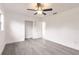 Bedroom featuring neutral walls, grey wood floors, and a ceiling fan at 3129 Buttonwood Pl, Punta Gorda, FL 33950