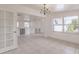 Bright dining room with large windows, modern lighting, and an open view into the updated kitchen area at 3129 Buttonwood Pl, Punta Gorda, FL 33950