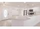 Stylishly renovated kitchen features modern countertops, white cabinetry, stainless steel appliances, and a breakfast bar at 3129 Buttonwood Pl, Punta Gorda, FL 33950
