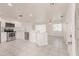 Modern kitchen with white cabinets, stainless steel appliances, and an open layout flowing into the adjacent dining area at 3129 Buttonwood Pl, Punta Gorda, FL 33950
