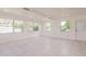Living room boasts neutral walls, tile flooring, large windows and ample natural light at 3129 Buttonwood Pl, Punta Gorda, FL 33950