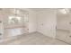 Living room boasts ample natural light, complemented by sleek tile flooring throughout the space at 3129 Buttonwood Pl, Punta Gorda, FL 33950
