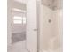 A shower with white surround and a built-in seat is visible through an open doorway at 3129 Buttonwood Pl, Punta Gorda, FL 33950