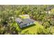 Stunning aerial view of a cozy home surrounded by trees and green grass at 355 Milton St, Port Charlotte, FL 33954