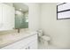 Modern bathroom showcasing a marble vanity, contemporary toilet, and glass-enclosed shower at 355 Milton St, Port Charlotte, FL 33954