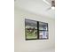 Bedroom showcasing a modern ceiling fan and a window with a view of lush greenery at 355 Milton St, Port Charlotte, FL 33954
