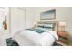 Inviting bedroom with a cozy bed, stylish lamps, and a closet with sliding doors at 355 Milton St, Port Charlotte, FL 33954