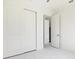 An empty bedroom featuring a closet with sliding doors and marble floors at 355 Milton St, Port Charlotte, FL 33954