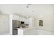Well-lit modern kitchen with stainless steel appliances and an island, seamlessly blending style and functionality at 355 Milton St, Port Charlotte, FL 33954
