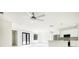 Bright open-plan living area with white walls and marble-look tile flooring. The room benefits from lots of natural light at 355 Milton St, Port Charlotte, FL 33954
