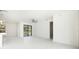 Spacious living area with tile floors, fan, and natural light, creating a bright and airy atmosphere at 355 Milton St, Port Charlotte, FL 33954