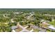 Aerial view of a residential neighborhood featuring mature trees, paved roads and beautifully maintained single-Gathering homes at 3799 Laredo Ave, North Port, FL 34288