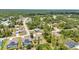 Explore this aerial view of a residential neighborhood, where lush landscaping and well-maintained homes create a tranquil setting at 3799 Laredo Ave, North Port, FL 34288