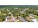 Discover this charming neighborhood with an aerial view of well-kept homes, lush greenery, and inviting streets at 3799 Laredo Ave, North Port, FL 34288
